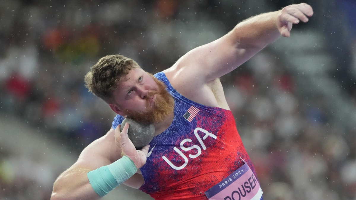 Ryan Crouser competes in the men's shot put final during the Paris Olympic Summer at Stade de France.