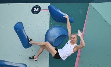 Janja Garnbret celebrates topping a boulder