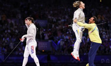 Olga Kharlan celebrates with coach as Jeon Ha-Young walks away