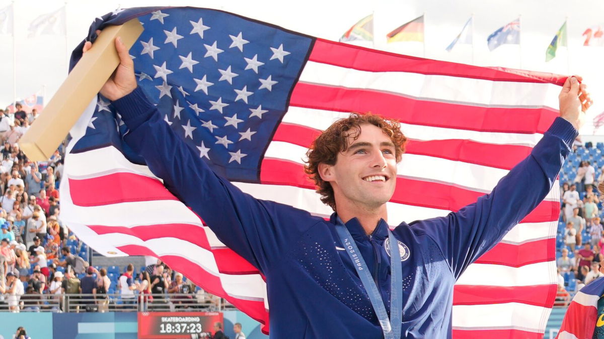 Tom Schaar holds the American flag