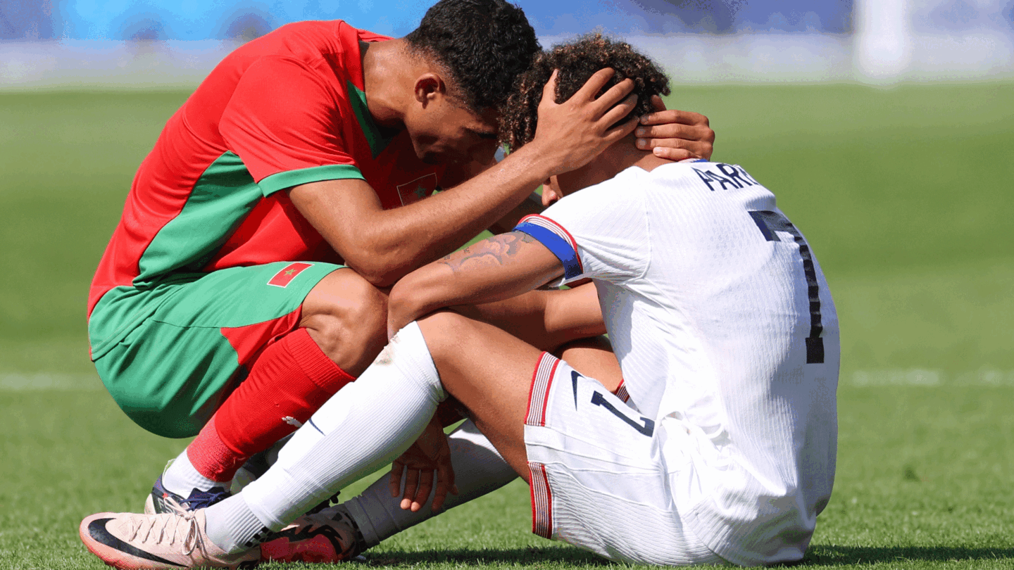 Morocco's Achraf Hakimi consoles a distraught Nathan Harriel of the U.S. after elimination from the 2024 Paris Olympics