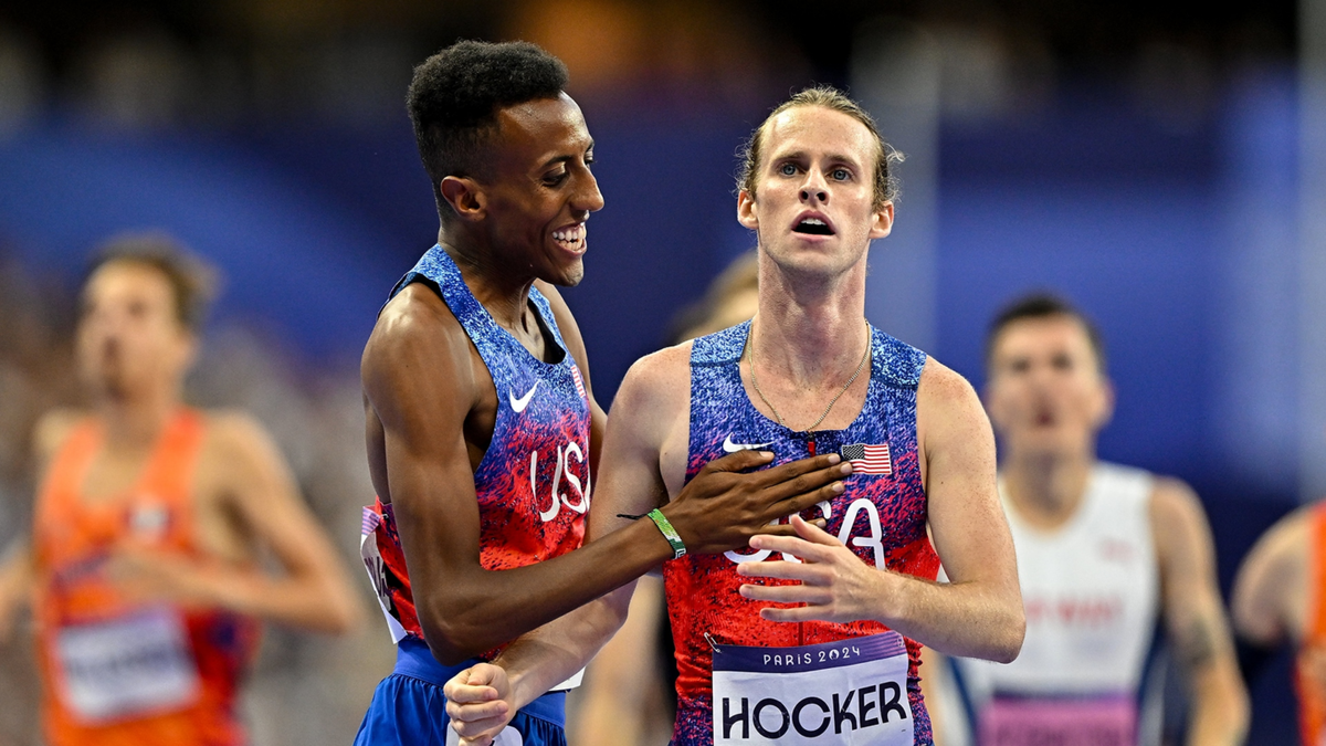 Bronze medalist Yared Nuguse and gold medalist Cole Hocker celebrate after the men's 1500m final at the Paris Olympic Games.