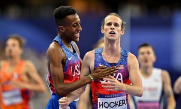 Bronze medalist Yared Nuguse and gold medalist Cole Hocker celebrate after the men's 1500m final at the Paris Olympic Games.