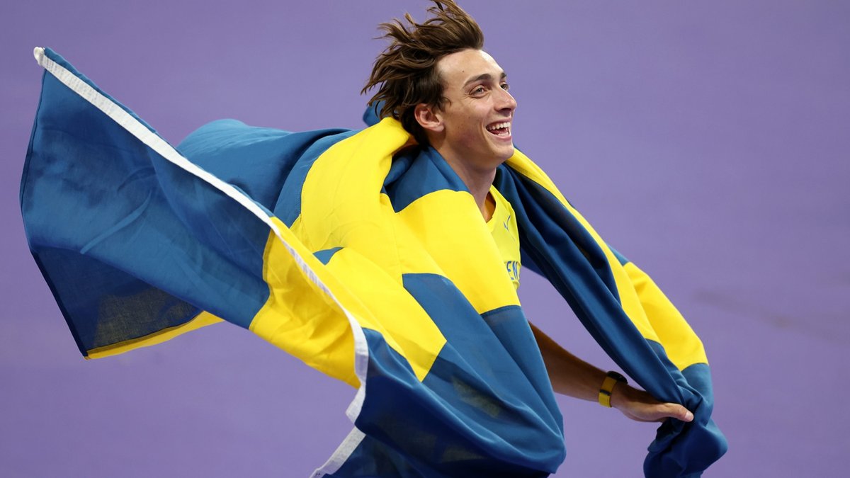 Gold medalist Mondo Duplantis of Sweden celebrates after setting a new world record during the men's pole vault final.