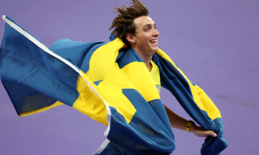 Gold medalist Mondo Duplantis of Sweden celebrates after setting a new world record during the men's pole vault final.