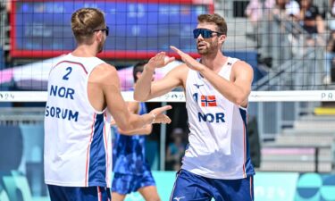 Christian Sandlie Soerum of Norway and Anders Berntsen Mol of Norway high-five during the Men's Beach Volleyball Round of 16 at Eiffel Tower Stadium.