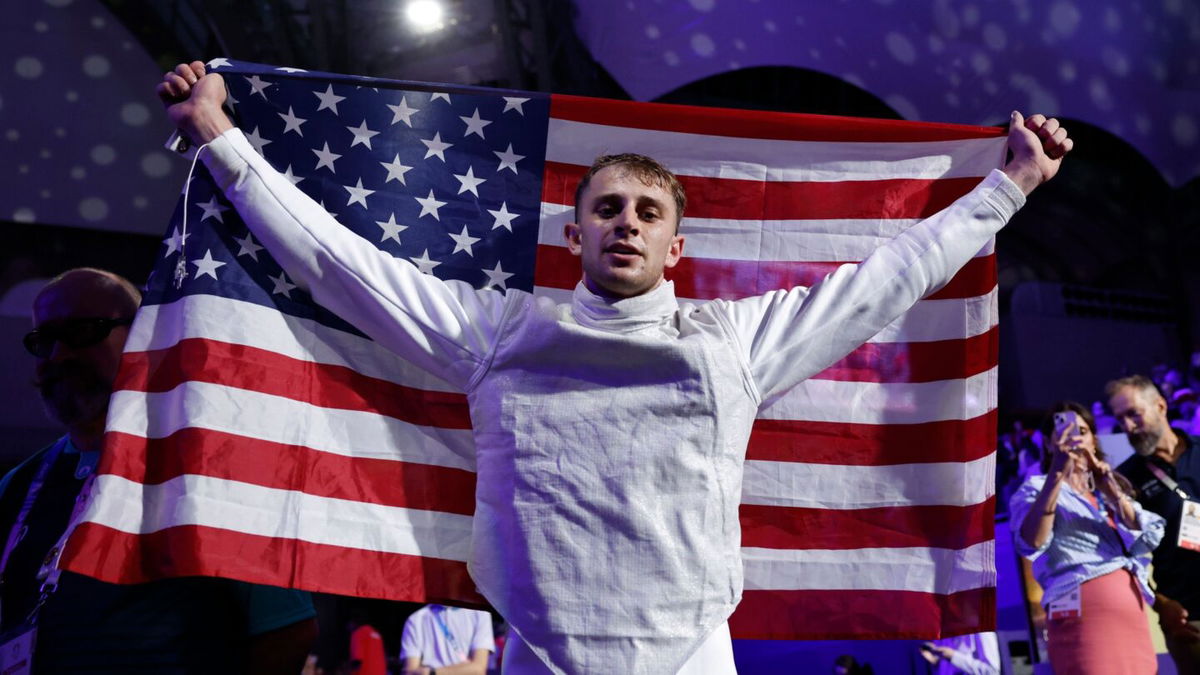 Nick Itkin holding American flag