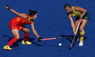 Kaitlin Nobbs of Australia is challenged by Jinzhuang Tan of China during a women's quarterfinal match on day ten of the 2024 Paris Olympics at Stade Yves Du Manoir on August 05