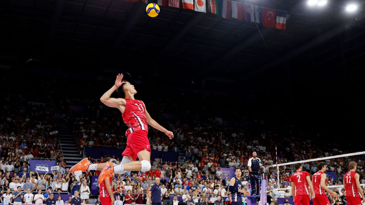 United States setter Micah Christenson serves against Japan during a men's volleyball pool C match during the Paris 2024 Olympic Summer Games