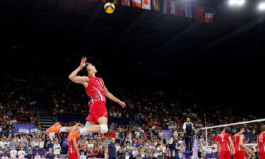 United States setter Micah Christenson serves against Japan during a men's volleyball pool C match during the Paris 2024 Olympic Summer Games