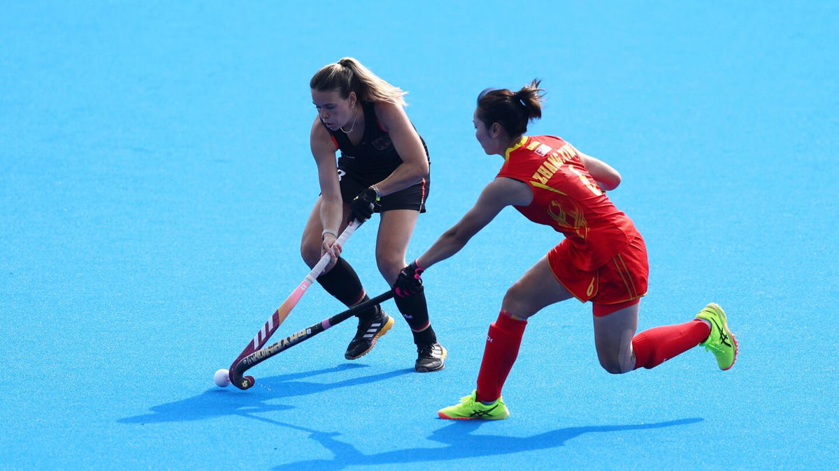 Anne Schroeder of Germany is challenged by Ying Zhang of China during the women's Pool A match on day seven of the 2024 Paris Olympics at Stade Yves Du Manoir on August 02