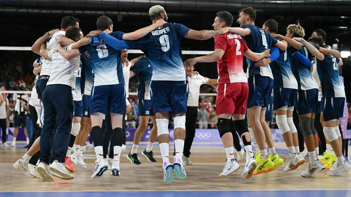 France's players celebrate after winning the men's volleyball gold medal match between France and Poland at the South Paris Arena