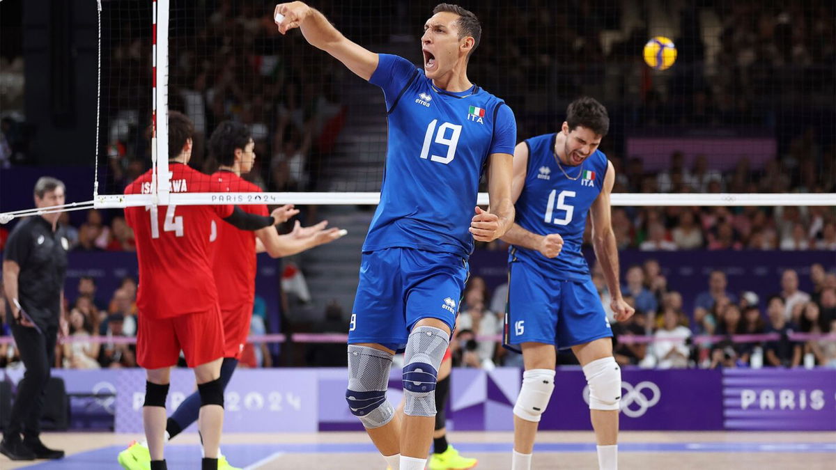 Roberto Russo of Italy celebrates after scoring a point during the Men's Quarterfinal match between Italy and Japan