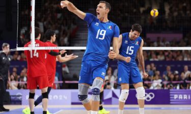 Roberto Russo of Italy celebrates after scoring a point during the Men's Quarterfinal match between Italy and Japan