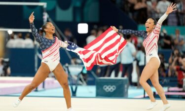 Jordan Chiles and Sunisa Lee of the United States celebrate after winning gold in the women’s team final at the 2024 Paris Olympics at Bercy Arena.