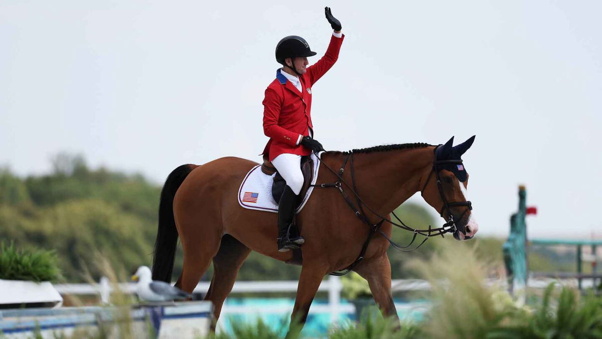 McLain Ward and horse Ilex of Team United States celebrate after their round in the Jumping Team Final on day seven of the Olympic Games Paris 2024 at Chateau de Versailles on August 02