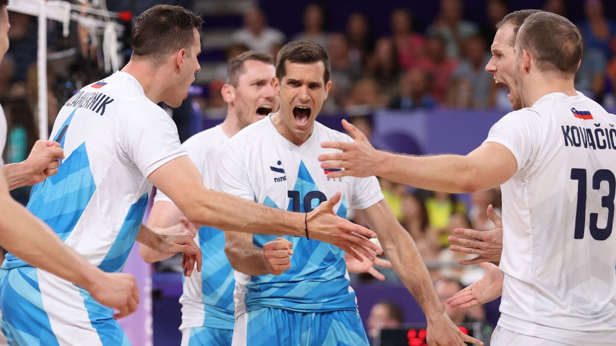 Gregor Ropret of Slovenia reacts with teammates during the Men's Preliminary Round - Pool A match between France and Slovenia