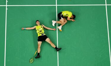 Yang Lee and Chi-Lin Wang of Chinese Taipei celebrate victory during the Badminton Men's Doubles Gold Medal match against Chang Wang and Wei Keng Liang of China