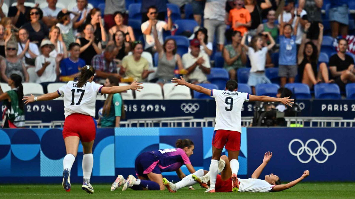 Players from the U.S. celebrate after Sophia Smith scored in the 95th minute during the women's semifinal match between the United States and Germany during the Paris Olympics at the Lyon Stadium on August 6