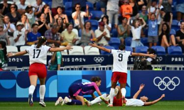 Players from the U.S. celebrate after Sophia Smith scored in the 95th minute during the women's semifinal match between the United States and Germany during the Paris Olympics at the Lyon Stadium on August 6