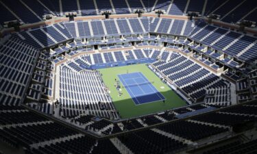Novak Djokovic holds up the trophy after defeating Daniil Medvedev in the 2023 US Open men's singles final.