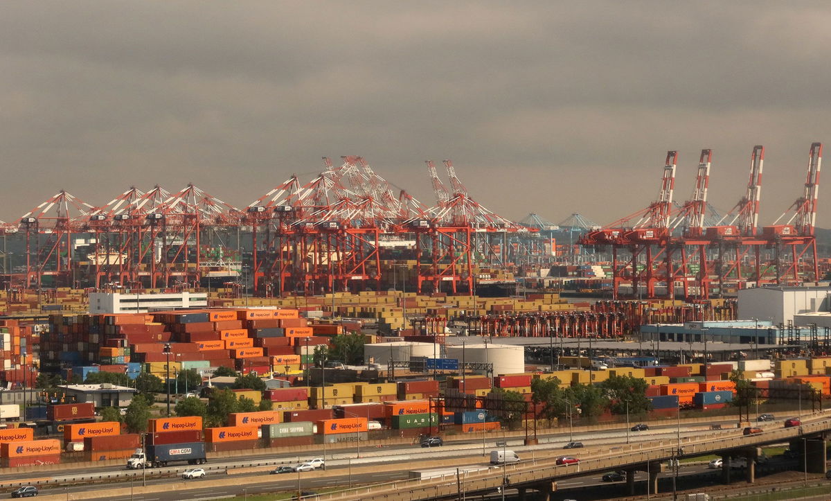 <i>Gary Hershorn/Getty Images via CNN Newsource</i><br/>Shipping containers sit on the dock at the Port Newark Container Terminal in Newark