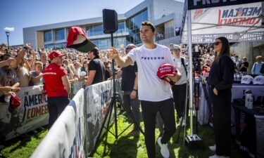 President Donald Trump shakes hands with moderator Charlie Kirk during a Generation Next White House forum in Washington