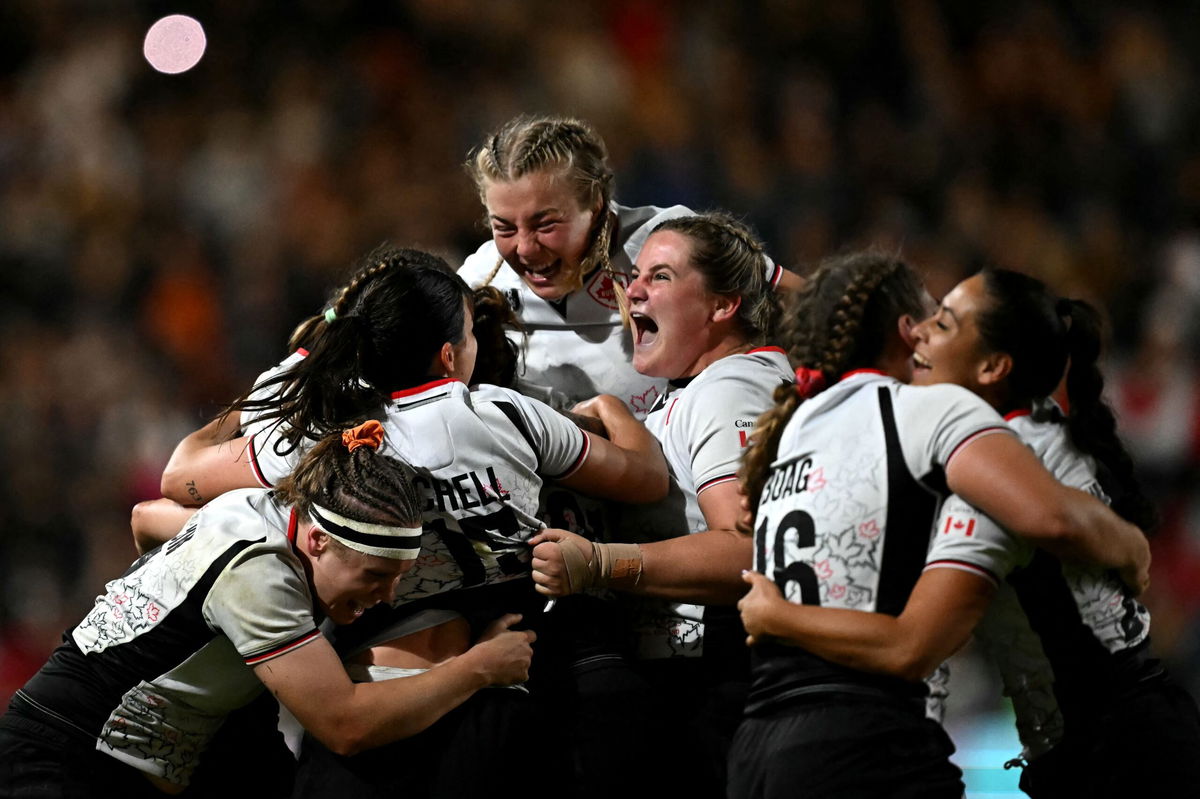 <i>David Rogers/Getty Images via CNN Newsource</i><br/>New Zealand's Ayesha Leti-I'iga attempts to gather the loose ball while under pressure from Canada's Shoshanah Seumanutafa.