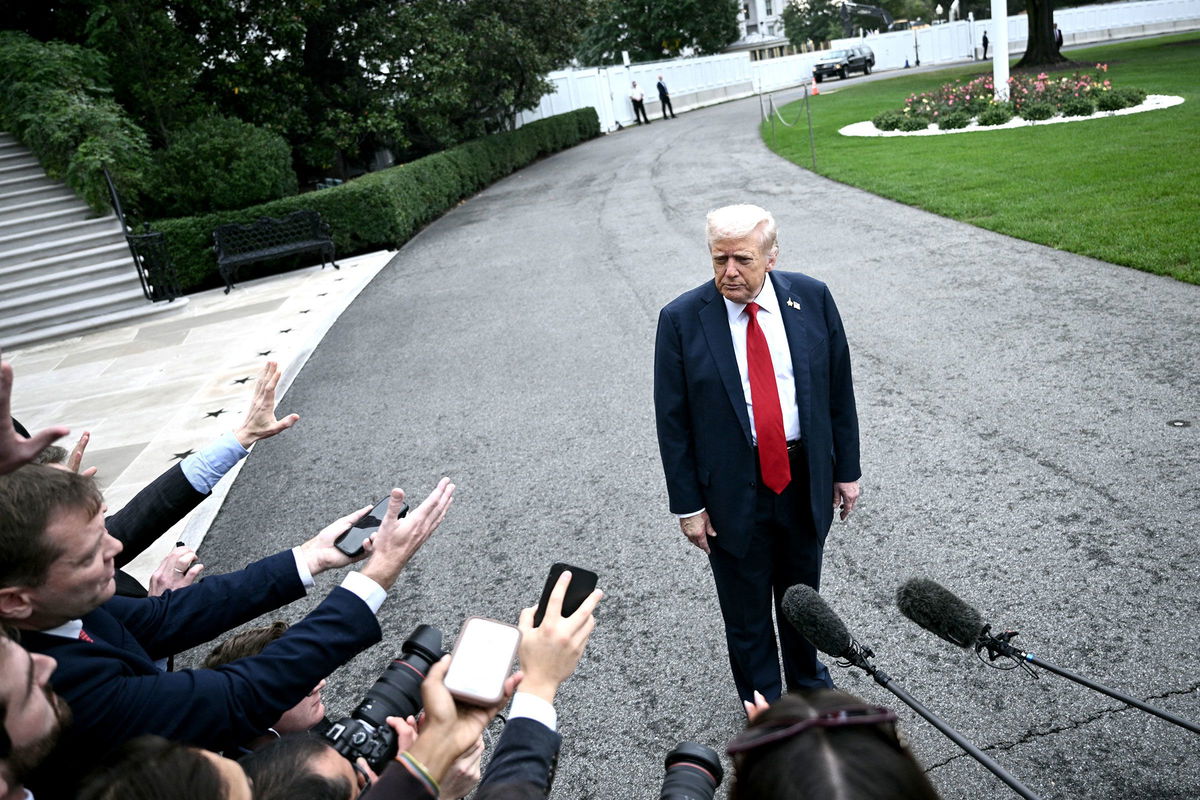<i>Brendan Smialowski/AFP/Getty Images via CNN Newsource</i><br/>President Donald Trump speaks to the press before departing the White House on September 30.