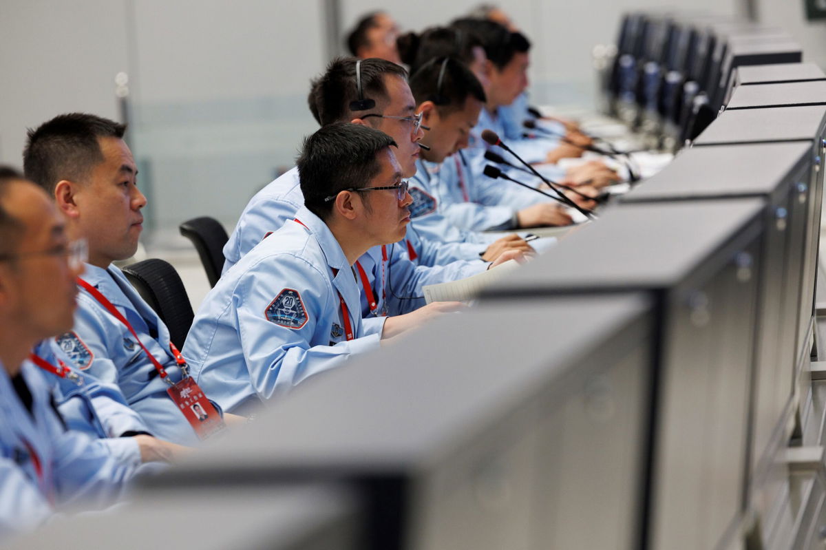 <i>Jin Liwang/Getty Images via CNN Newsource</i><br/>Technical personnel at Beijing Aerospace Control Center monitor the docking of the Shenzhou-20 crewed spacecraft with Tiangong space station on April 24.