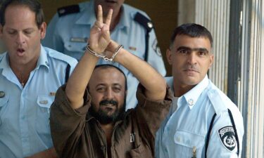 Palestinian leader Marwan Barghouti is taken away under escort on September 29
