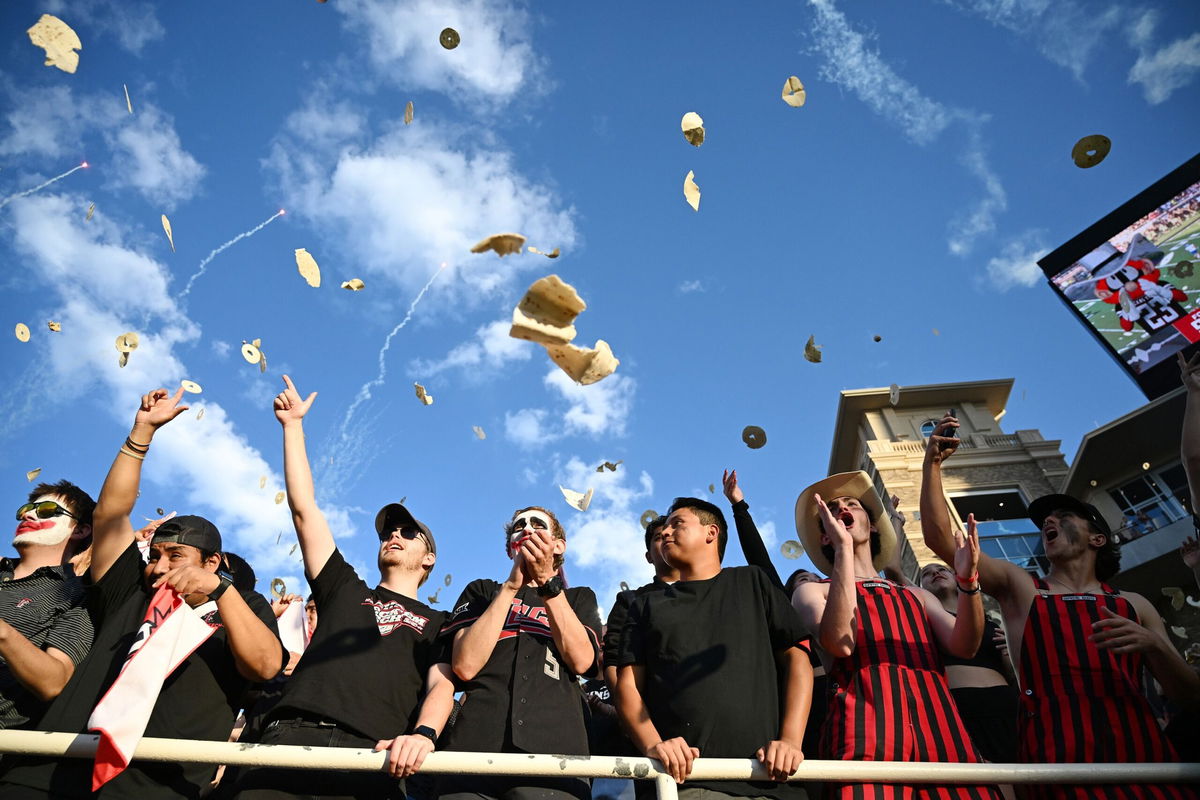 <i>Annie Rice/AP via CNN Newsource</i><br/>Texas Tech students throw tortillas before the game against Kansas on Saturday.