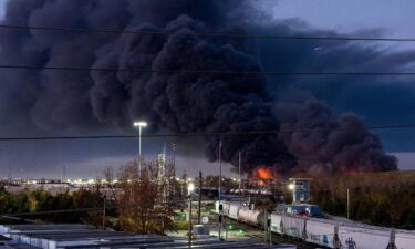 Fire and smoke mark where a UPS cargo plane crashed near Louisville Muhammad Ali International Airport on November 04