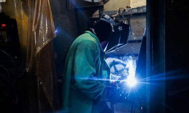 An apprentice demonstrates welding steel at the Hanwha Philly Shipyard Training Academy in Philadelphia on July 16.