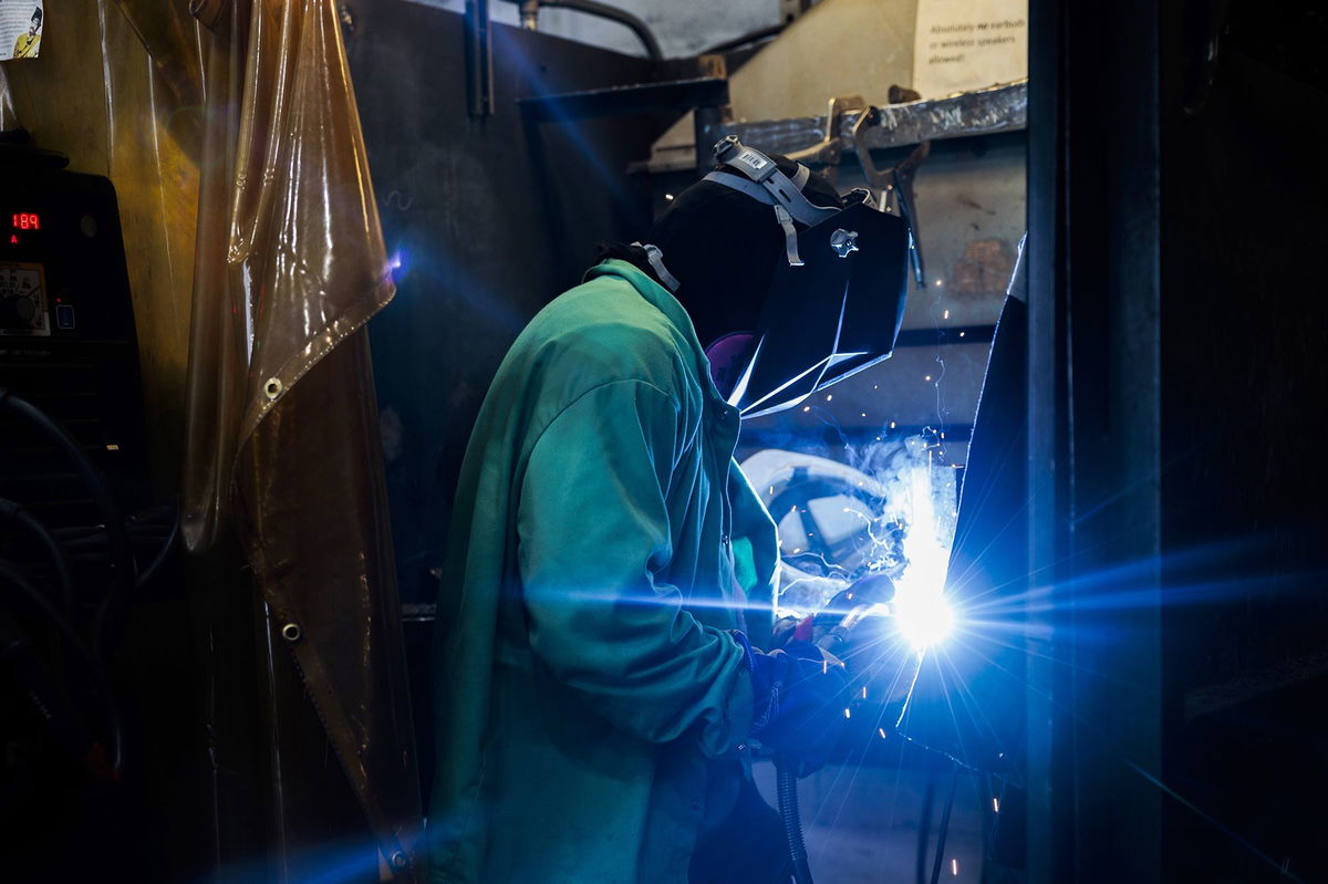 An apprentice demonstrates welding steel at the Hanwha Philly Shipyard Training Academy in Philadelphia on July 16.