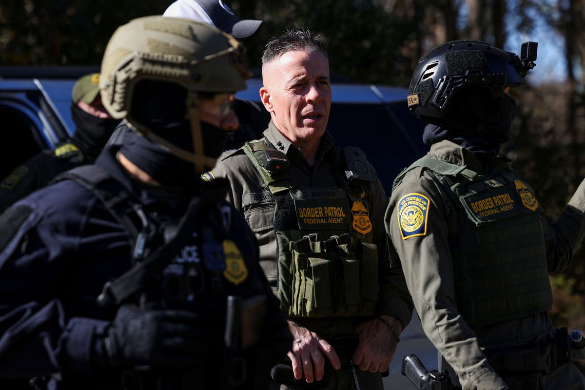 Top Border Patrol official Greg Bovino looks on during an immigration raid in Charlotte