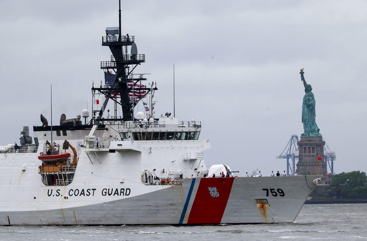A Coast Guard ship sails past the Statue of Liberty on May 21 in New York City.