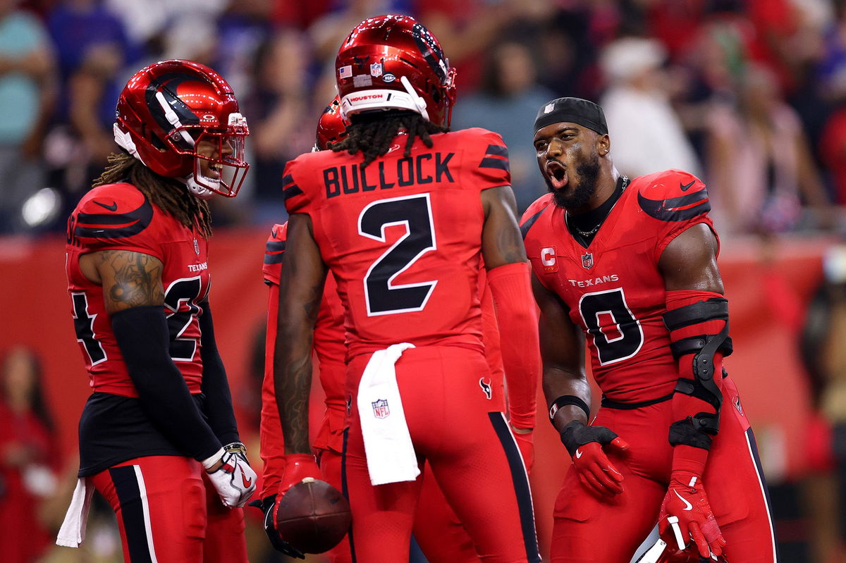 Houston Texans defenders Azeez Al-Shaair (#0) and Calen Bullock (#2) celebrate in the fourth quarter against the Buffalo Bills on November 20.