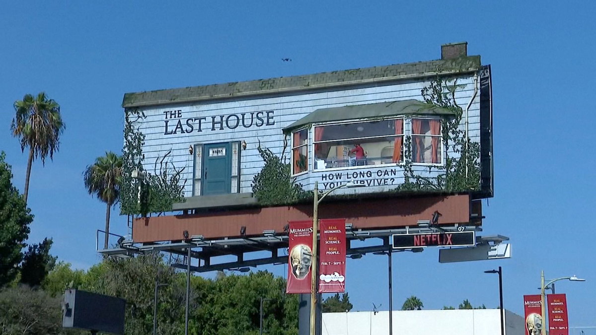 Performer lives inside furnished billboard above Sunset Boulevard